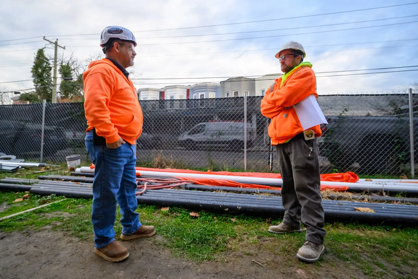 Two VXL team members in hi-vis on the job