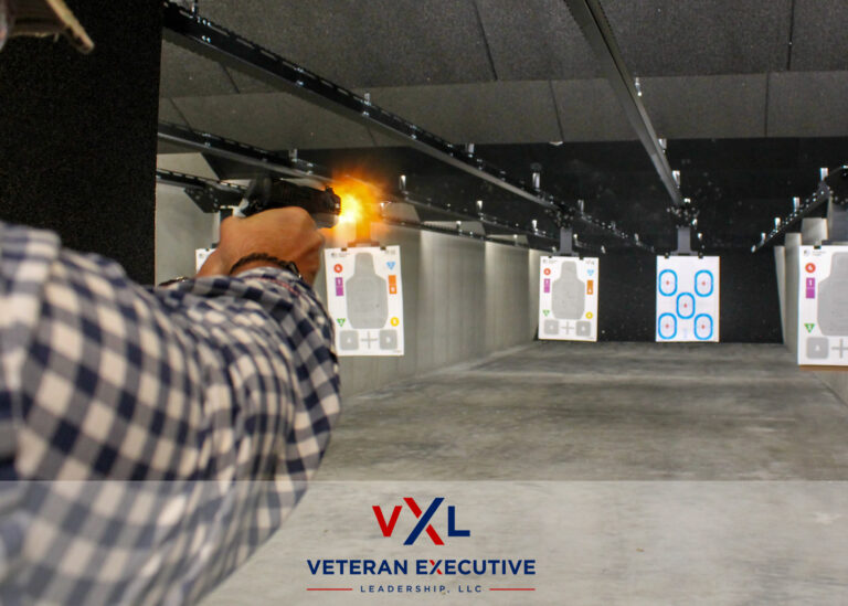 A man fires a pistol toward a target. Fire can be seen as the bullet is fired.